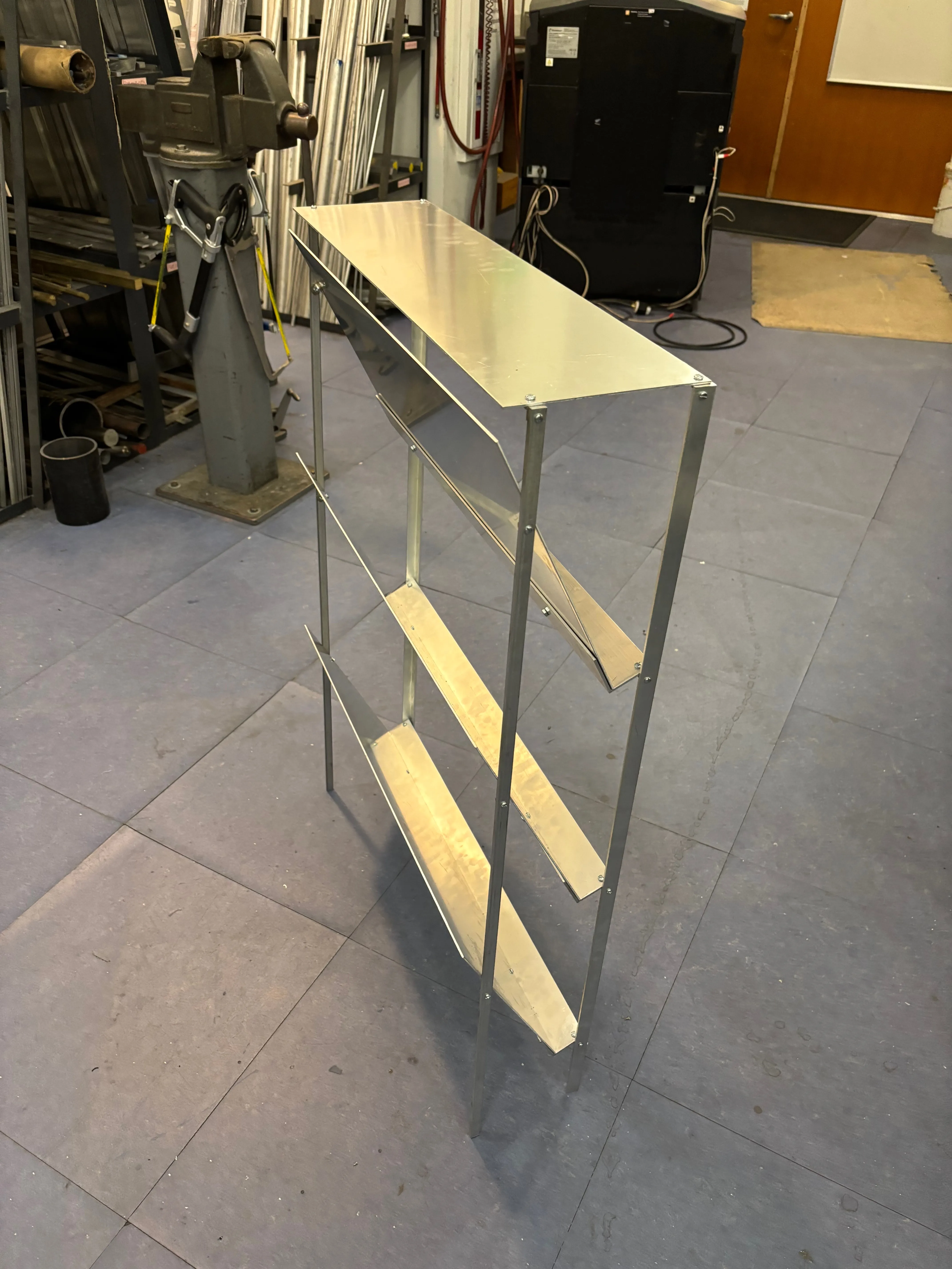 View from the back left of the fully assembled shoe rack, freestanding on the floor