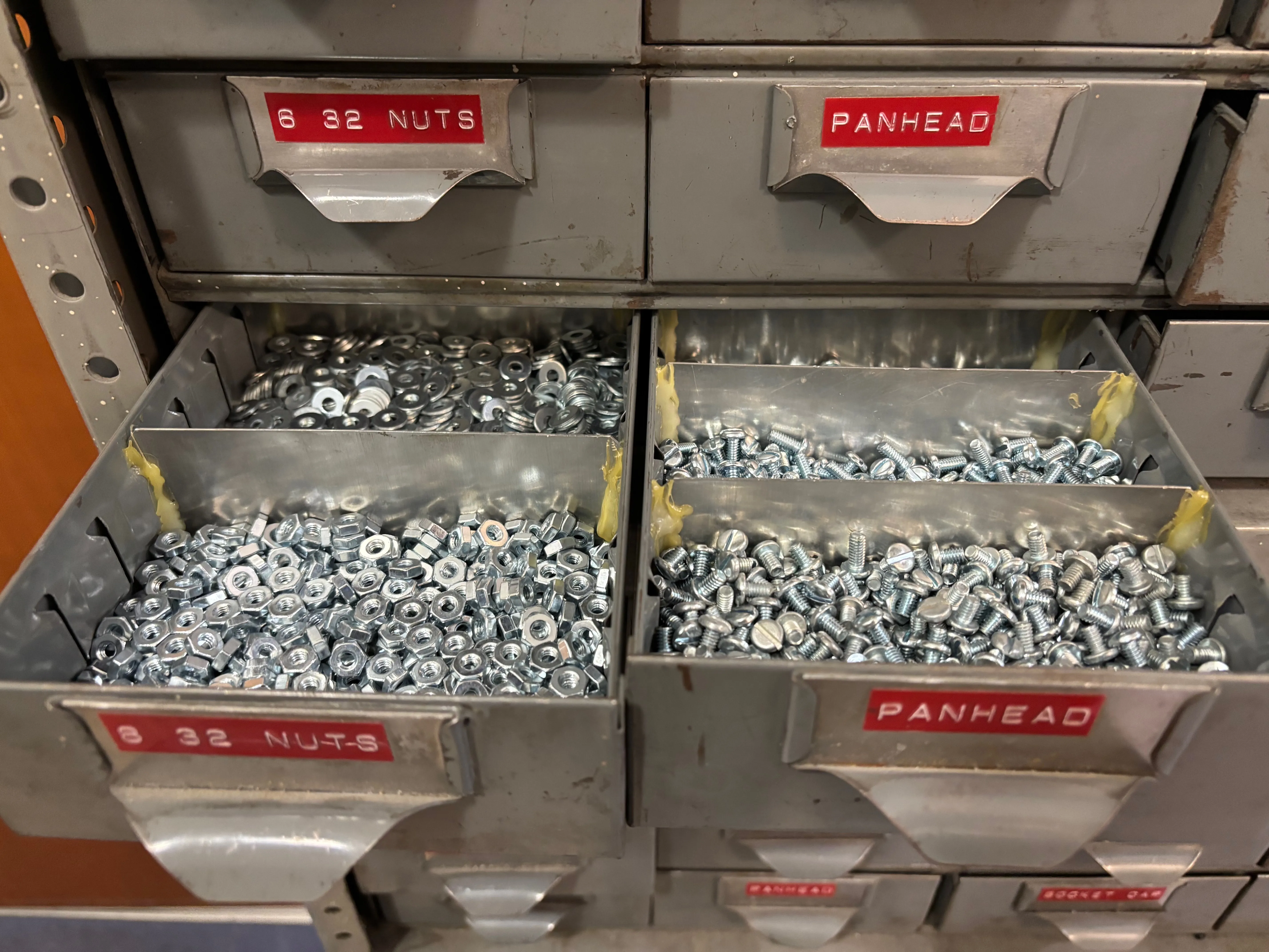 Drawers of 8/32 and 6/32 nuts, washers and pan-head bolts