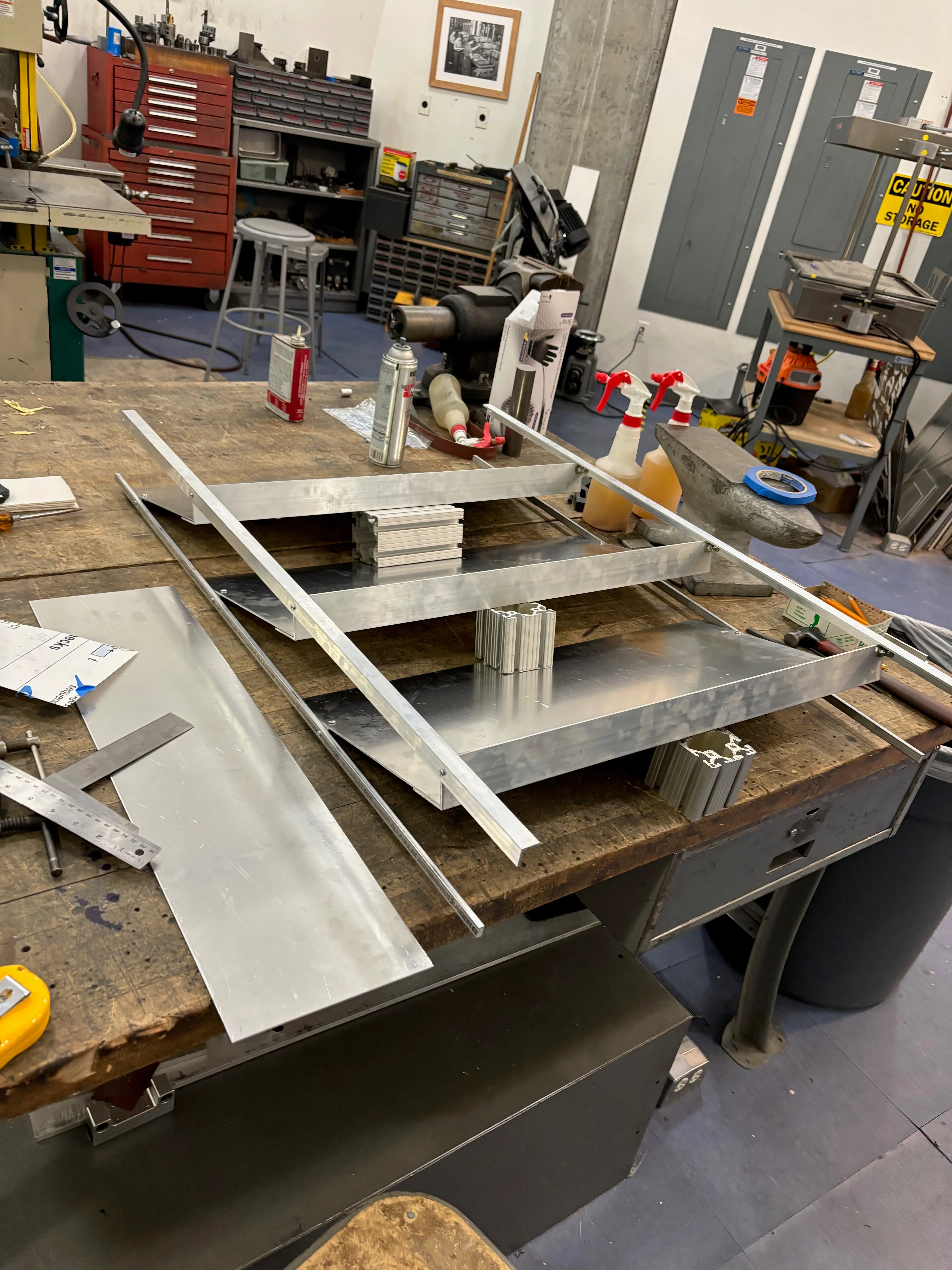 View from the bottom left of the partially assembled shoe rack on the workbench