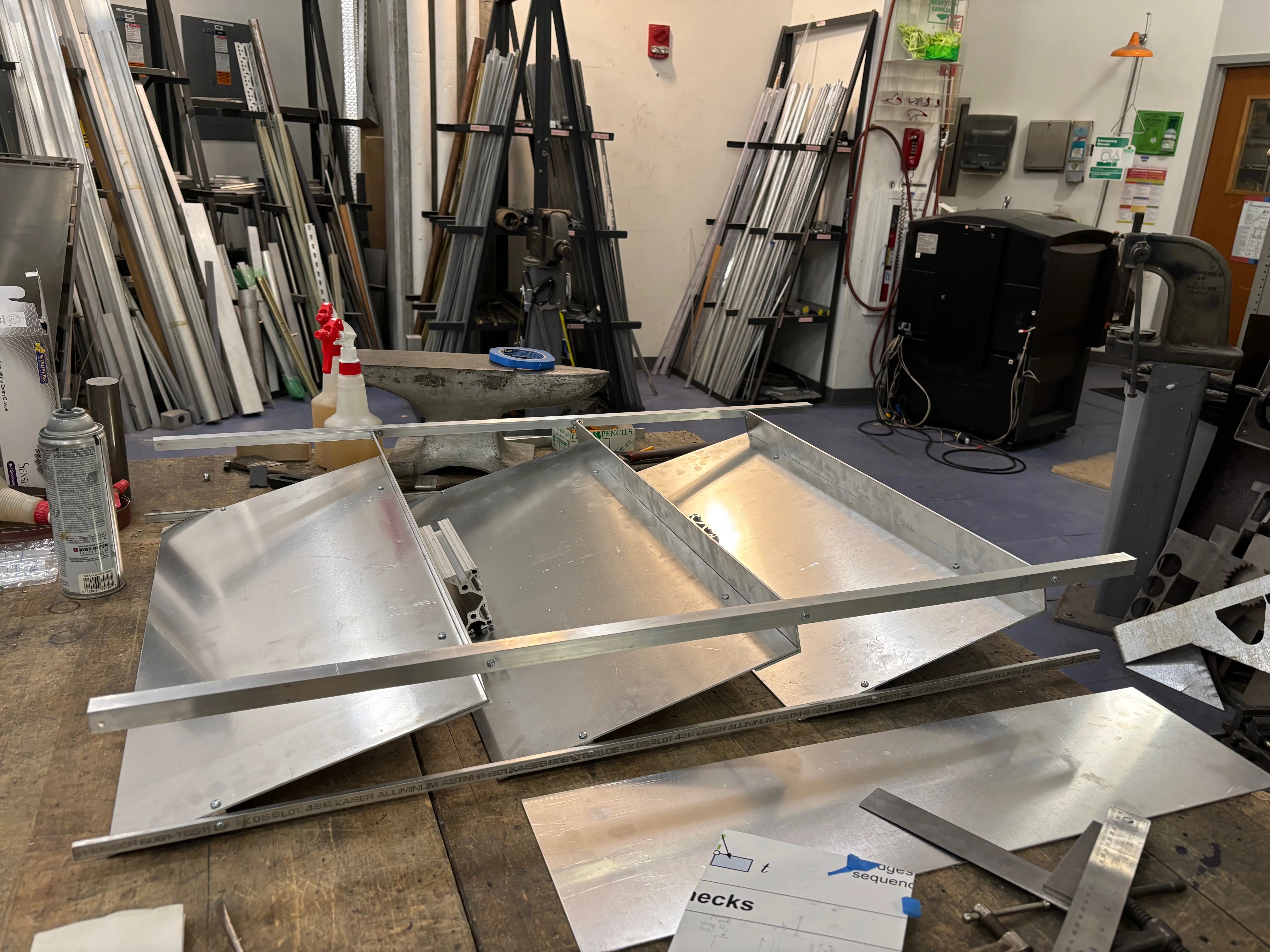 View from the left of the partially assembled shoe rack on the workbench