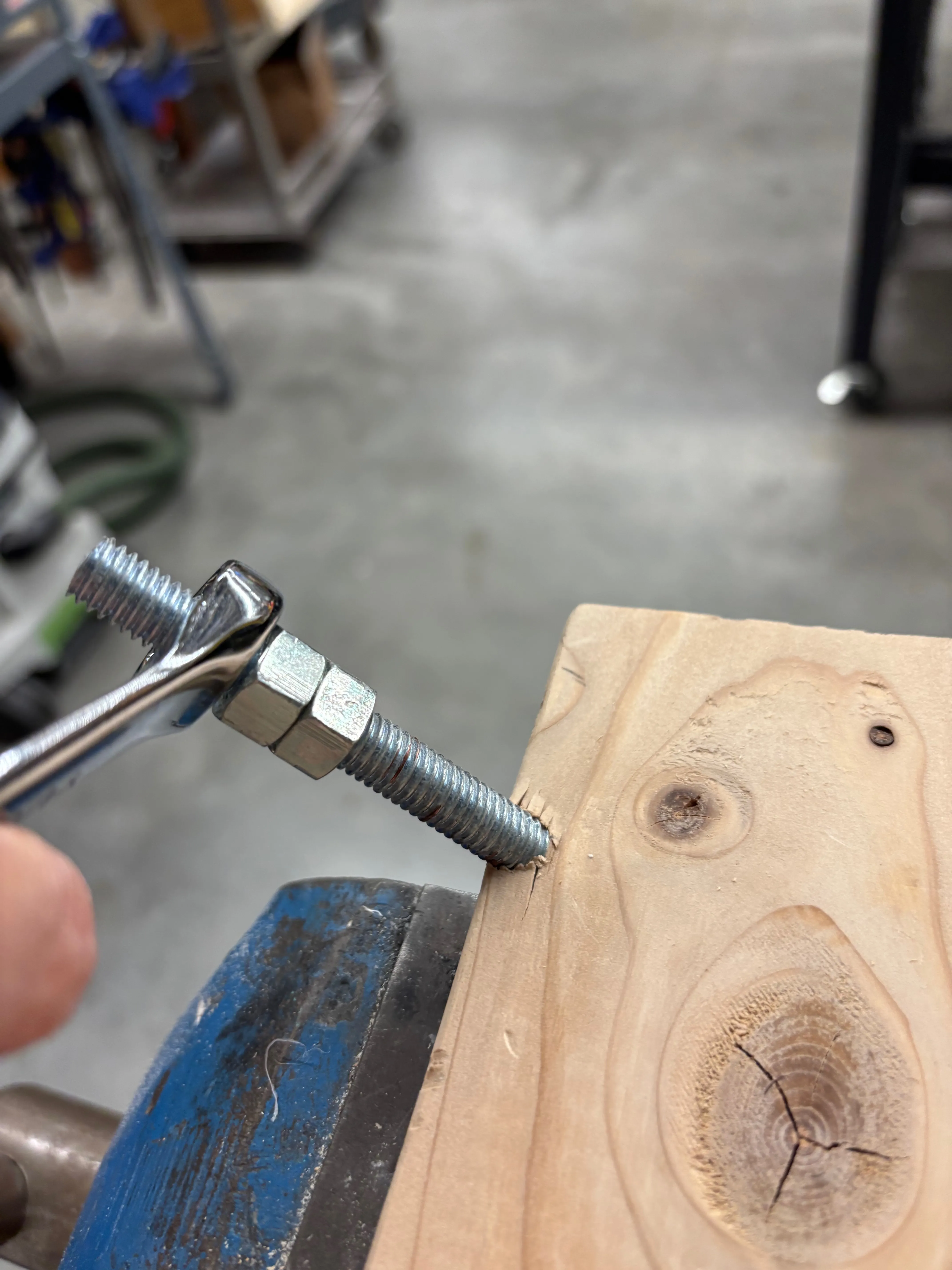 Screwing the threaded rod into the leg