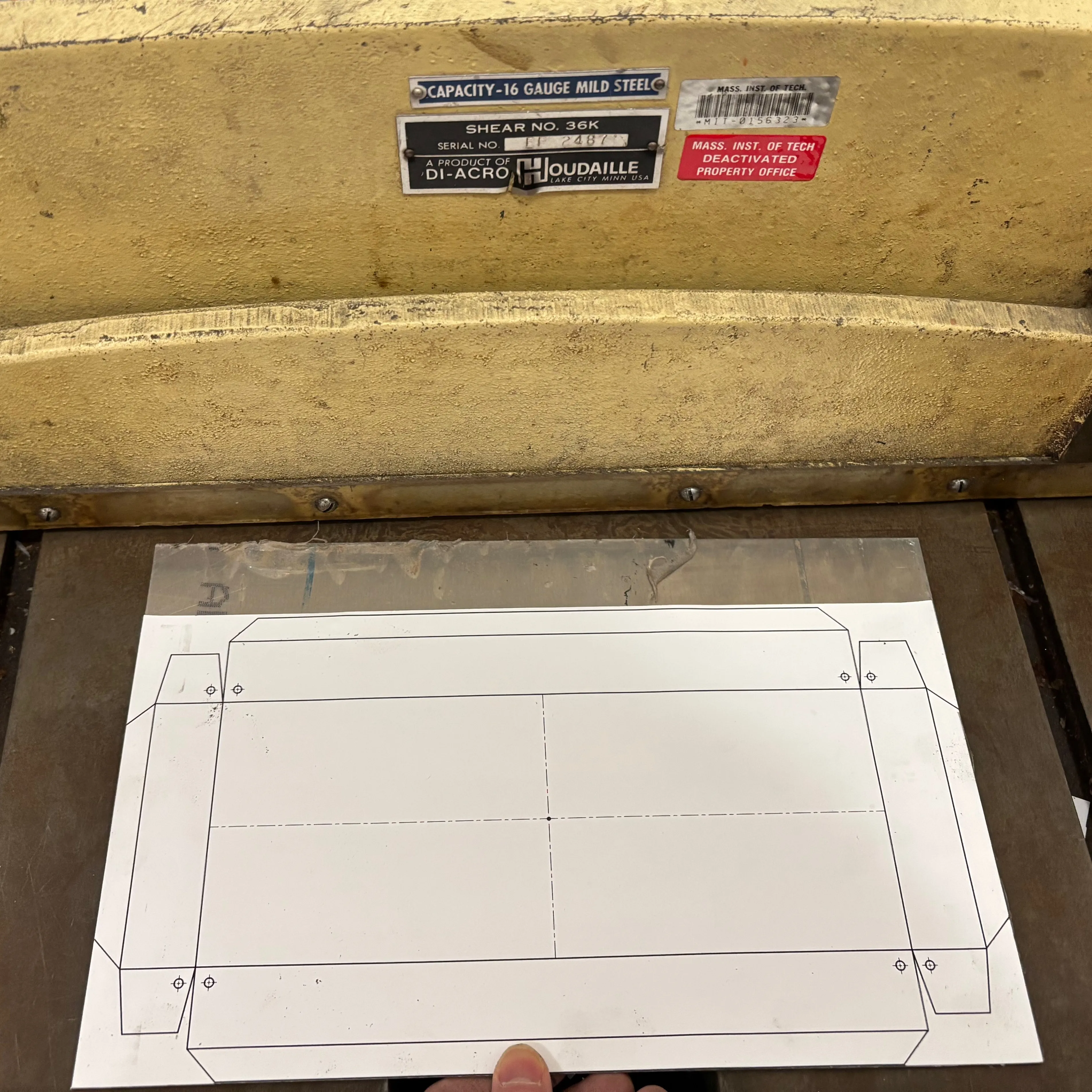 Sheet of aluminum about to be sheared to size.