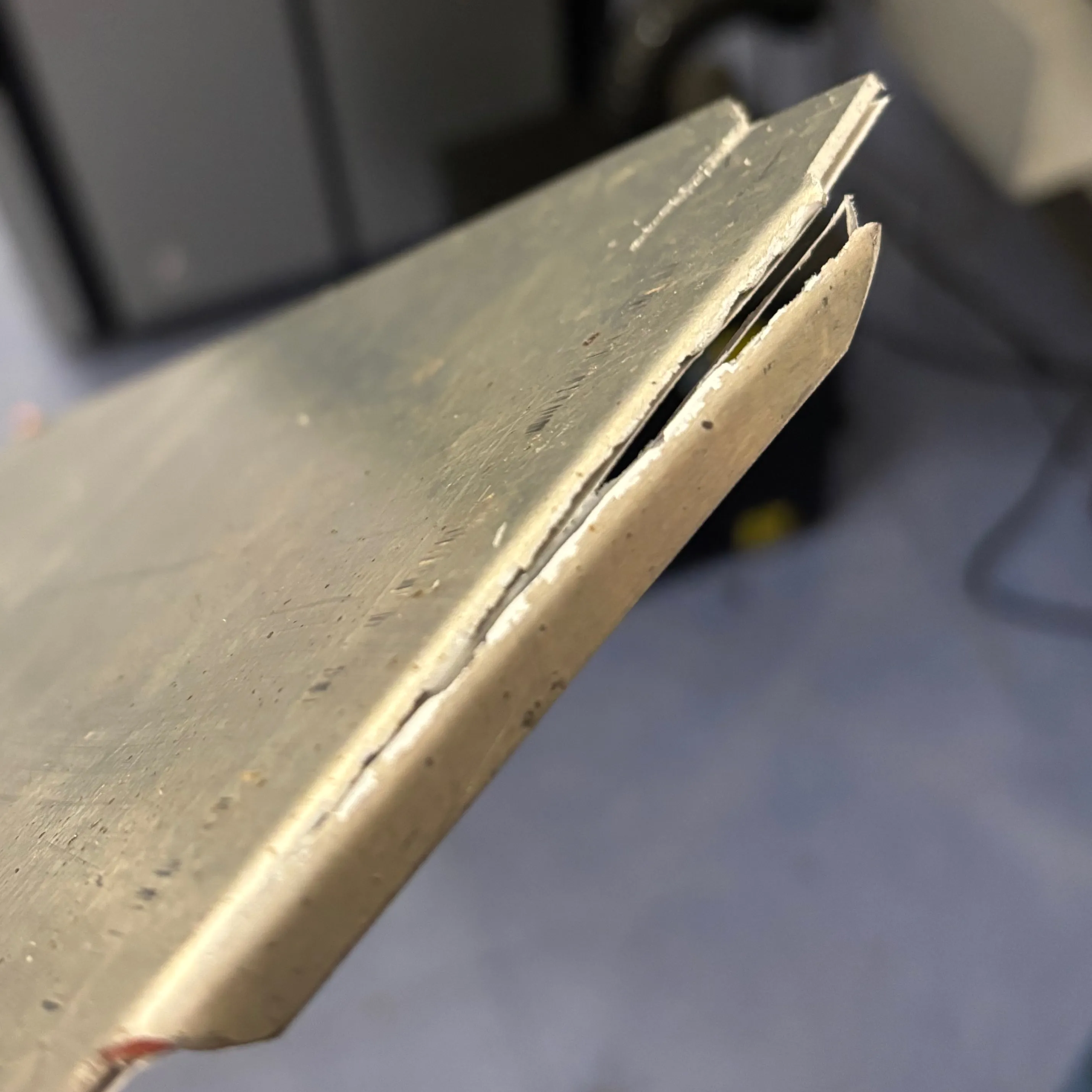 Tear in the alumium viewed from the back