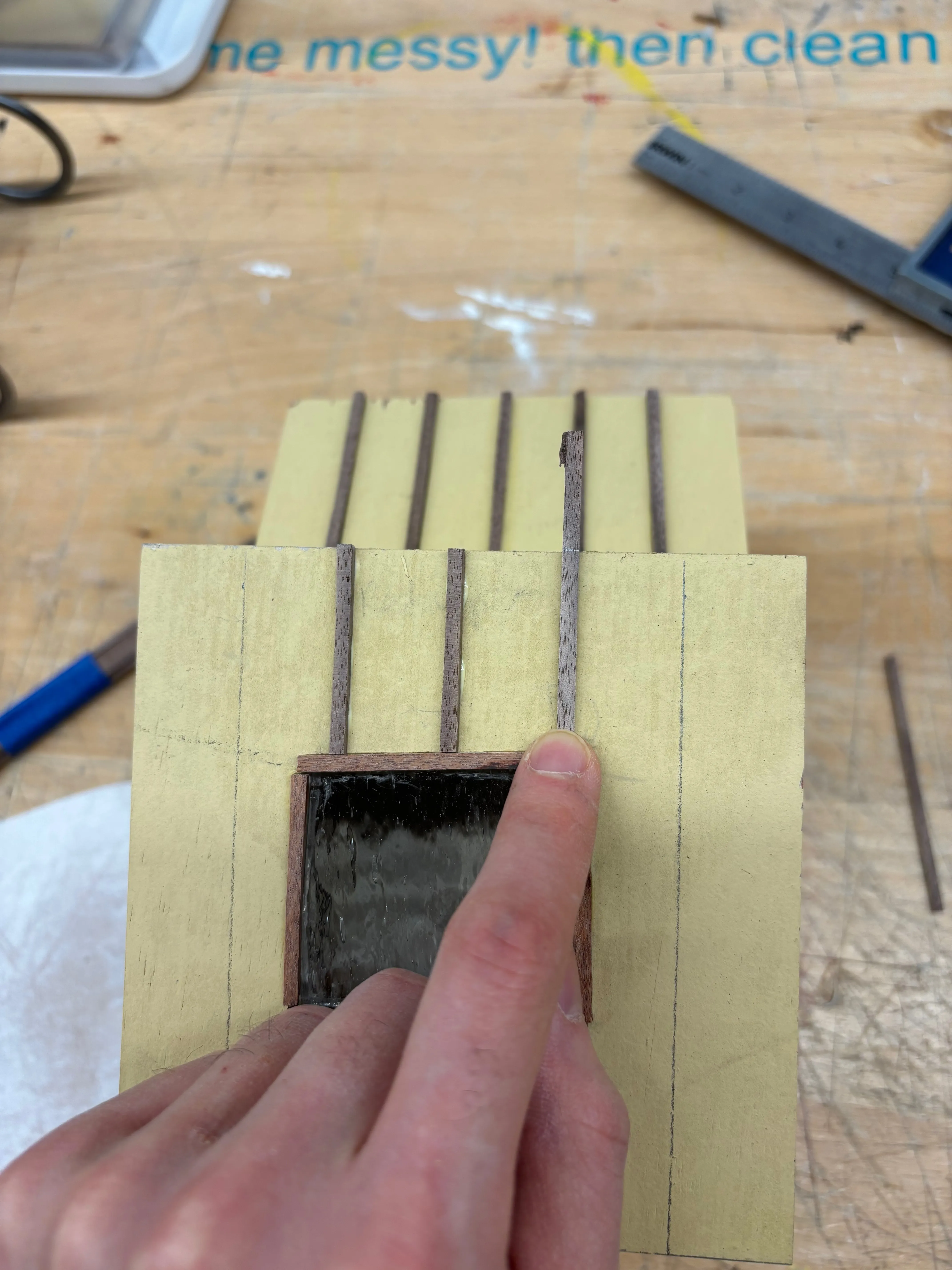 Adding trim to the roof.